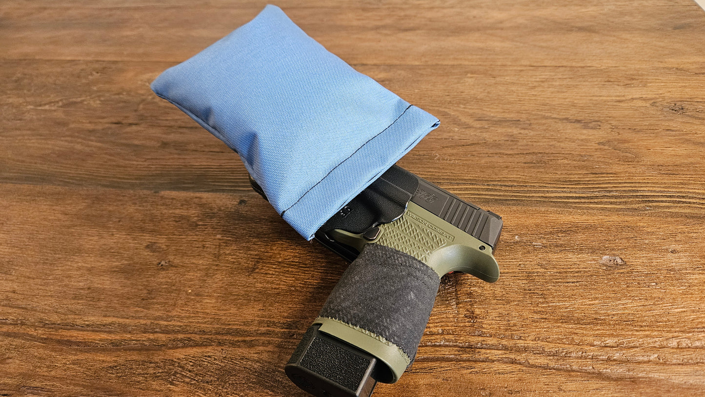 Periwinkle Stallster holster pillow attached to the back of a DeSantis holster, carrying a Sig Sauer P365 XL