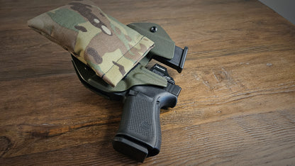 Original MultiCam Stallster holster pillow attached to a sidecar LLOD (Last Line of Defense) holster, carrying a Glock 19 and extra mag