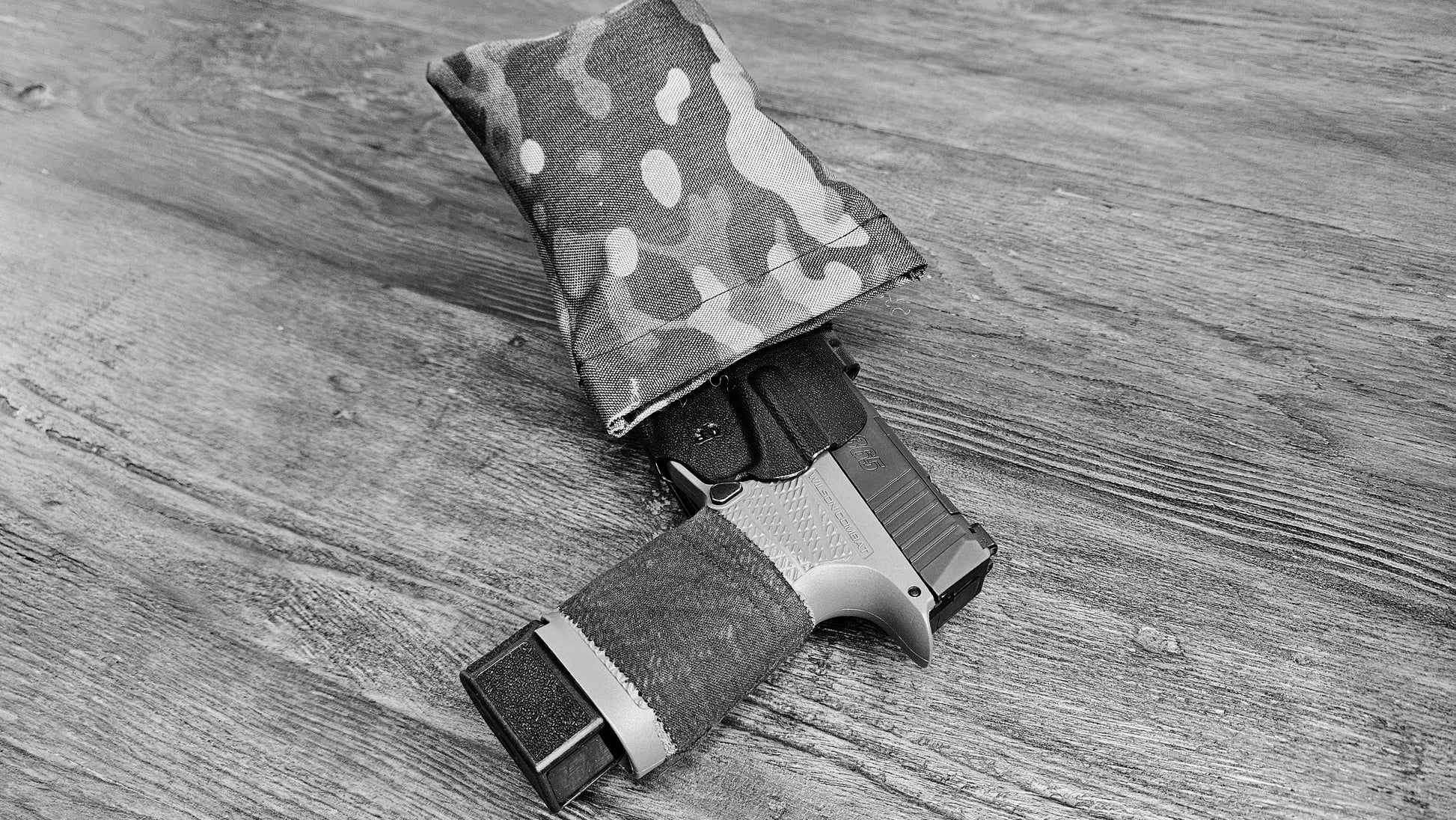 Original MultiCam Stallster holster pillow attached to a DeSantis holster, carrying a Sig Sauer P365XL, black and white photo