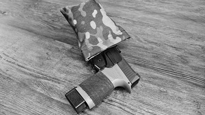 Original MultiCam Stallster holster pillow attached to a DeSantis holster, carrying a Sig Sauer P365XL, black and white photo