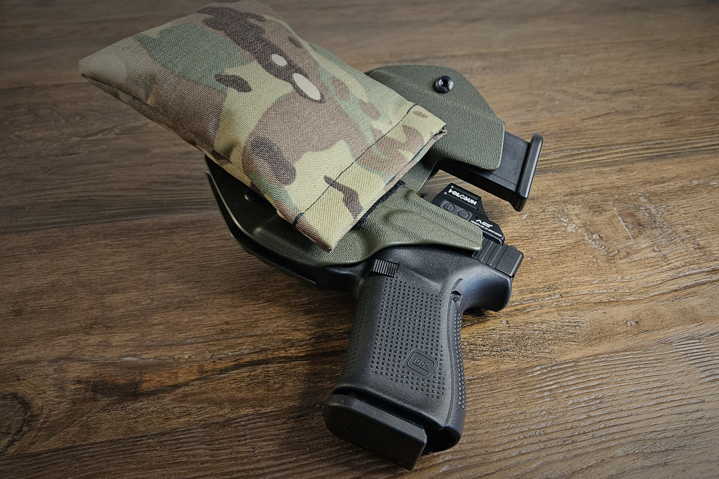 Original MultiCam Stallster holster pillow attached to the back of a LLOD (Last Line of Defense) holster, carrying a Glock 19