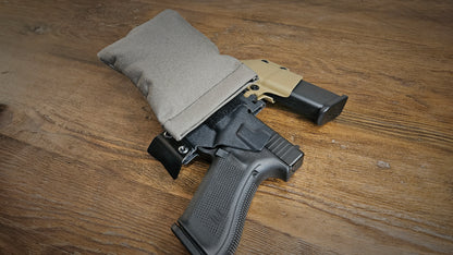 Ranger green Stallster holster pillow attached to T.Rex Arms sidecar holster, carrying a Glock 17 and extra mag