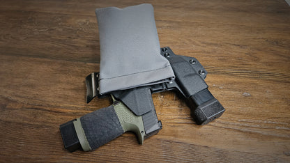 Tactical gray Stallster holster pillow attached to the back of a Vedder sidecar holster, carrying a Sig Sauer P365 XL and extra mag