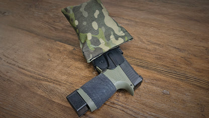 Tropic MultiCam Stallster holster pillow attached to the back of a DeSantis holster, carrying a Sig Sauer P365 XL