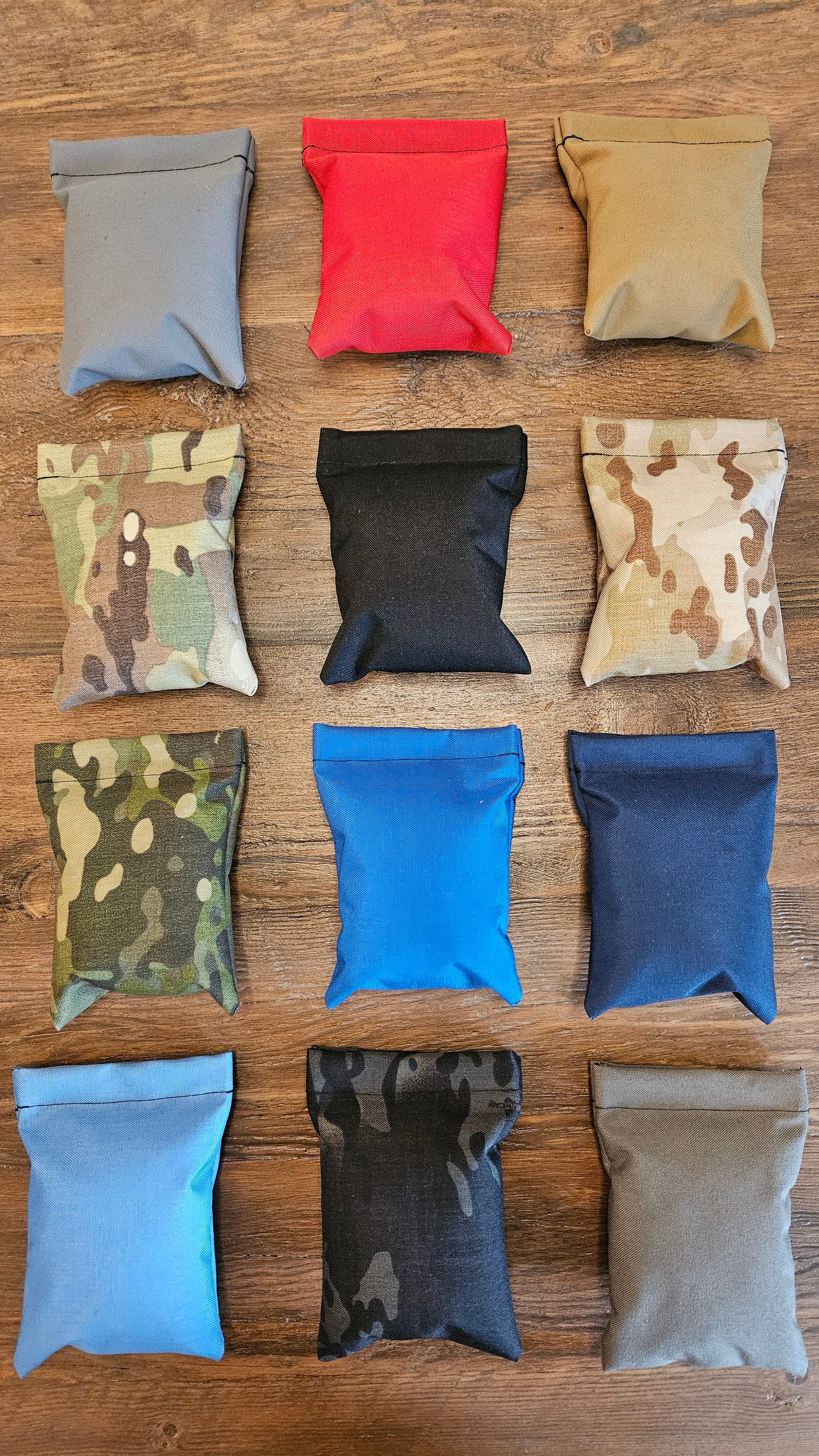 Stallster holster pillows in various colors and MultiCam camo patterns